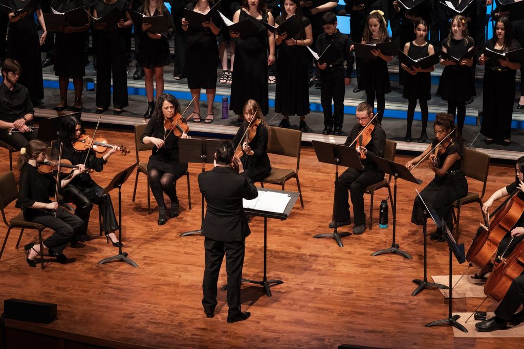 Sandy Lake Academy string orchestra and choir performing at the Rebecca Cohn Auditorium