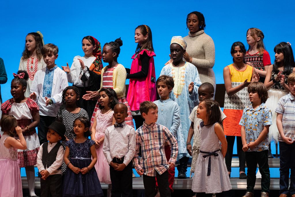 Sandy Lake Academy elementary students performing together on stage